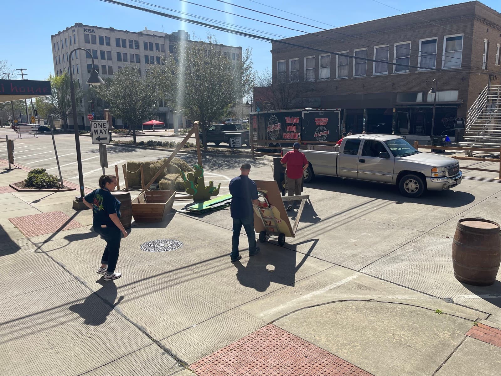 Loading a pickup truck on a downtown East Texas street